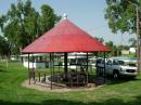 The open-air gazebo with a conical shaped red metal roof where the station was set up.