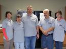 Wearing their ARRL Field Day shirts, Debra Hubbard, N1FQ (second from left) and Kevin Shissler, K1FQ (center), got married during Field Day at their Field Day site! Joining the happy couple were Lydia Beal (left), best man Lee Shissler (second from right) and Jan Watson (far right). [Phil Duggan, N1EP, Photo]