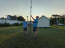 Scott Avery, AD4SA (left), and Corey Landrum, KB4PYN, working on an antenna ahead of a contest on Tangier Island, Virginia. [Sierra Harrop, W5DX, photo]